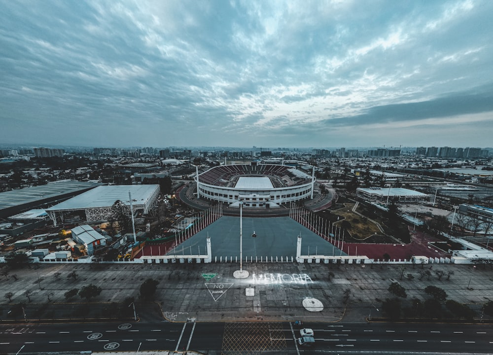 an aerial view of a stadium and parking lot