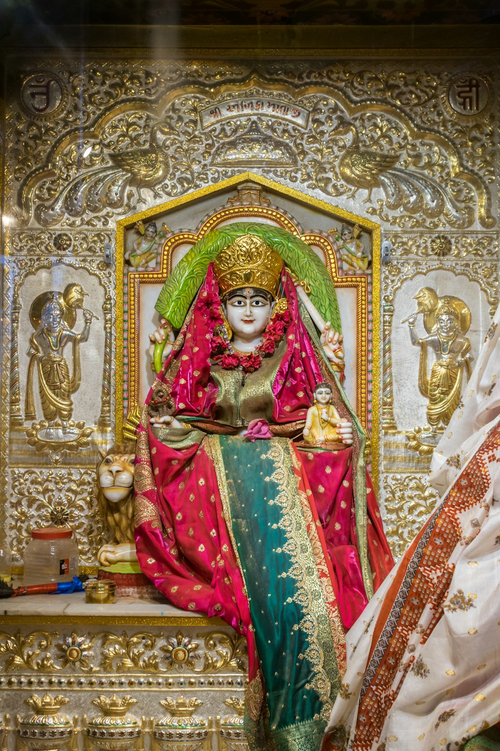 a statue of a woman sitting on top of a table