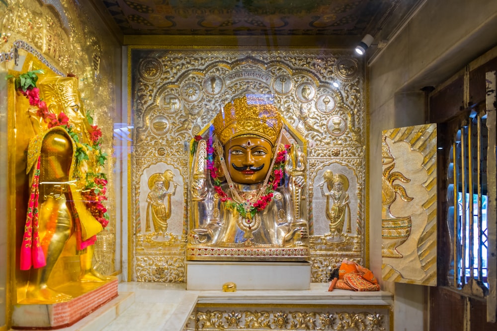 a golden statue of a buddha in a temple