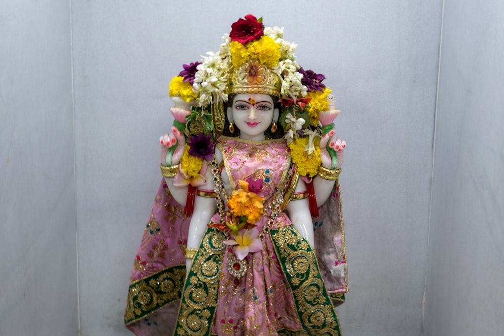 a statue of a woman with flowers in her hair