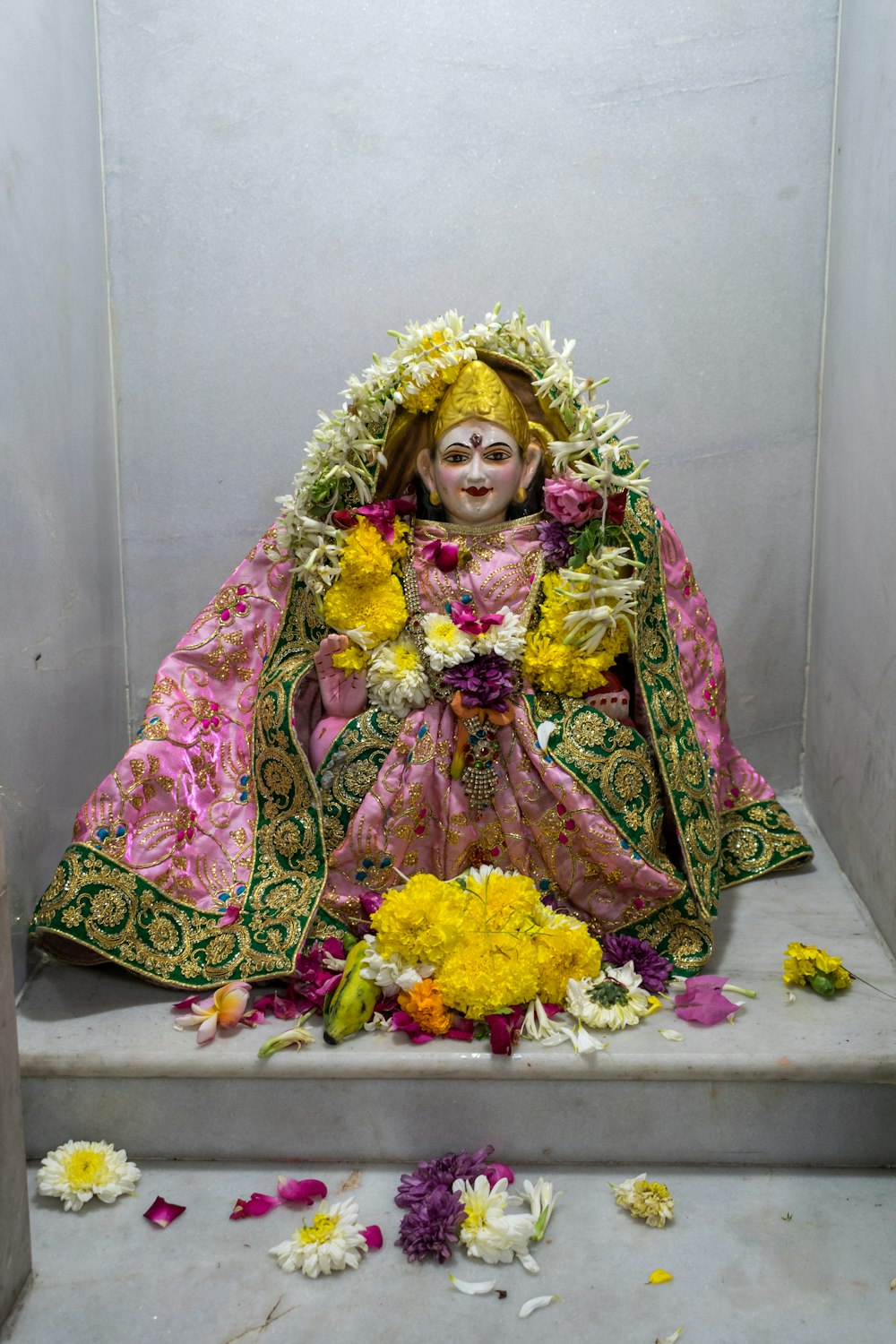 a statue of a woman sitting on a step