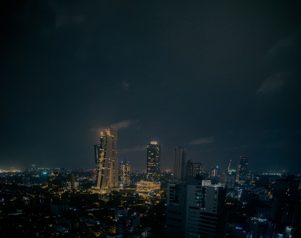 a view of a city at night from the top of a building