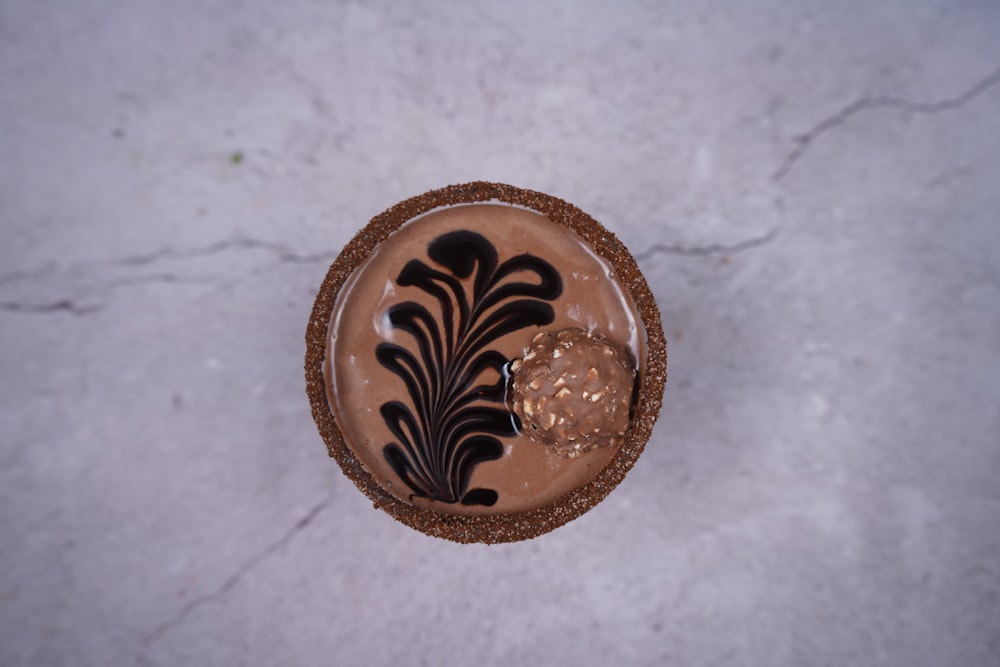 a chocolate dessert with a decorative decoration on top of it