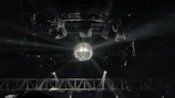 Elegant lighting rig casting colorful beams over a lively dance floor