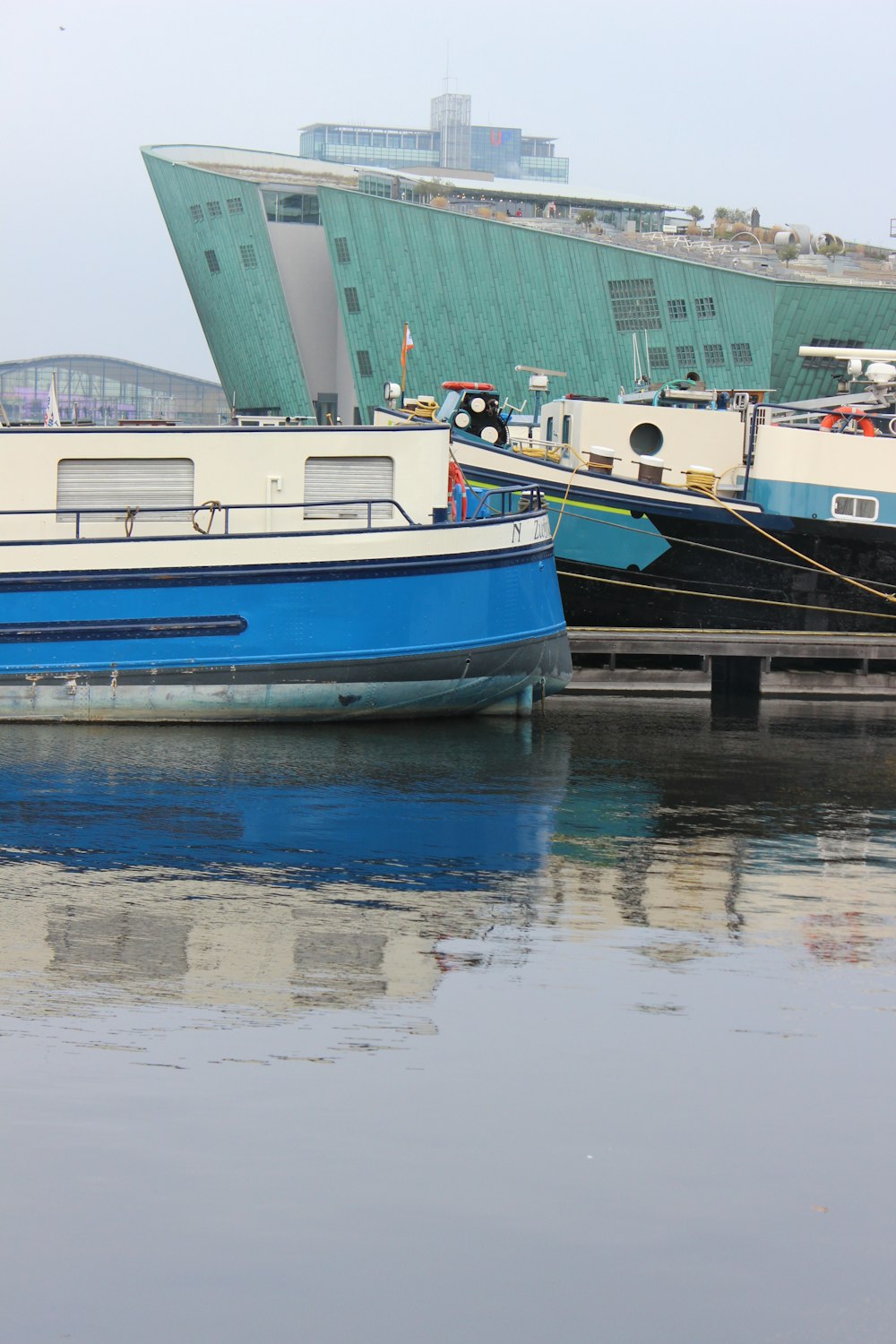 a couple of boats that are sitting in the water