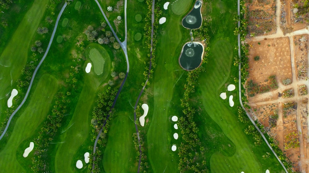 an aerial view of a green golf course