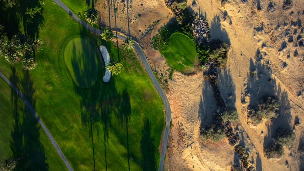 an aerial view of a golf course in the desert