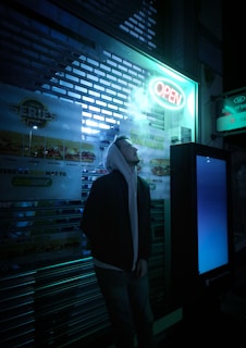 a man standing in front of a vending machine