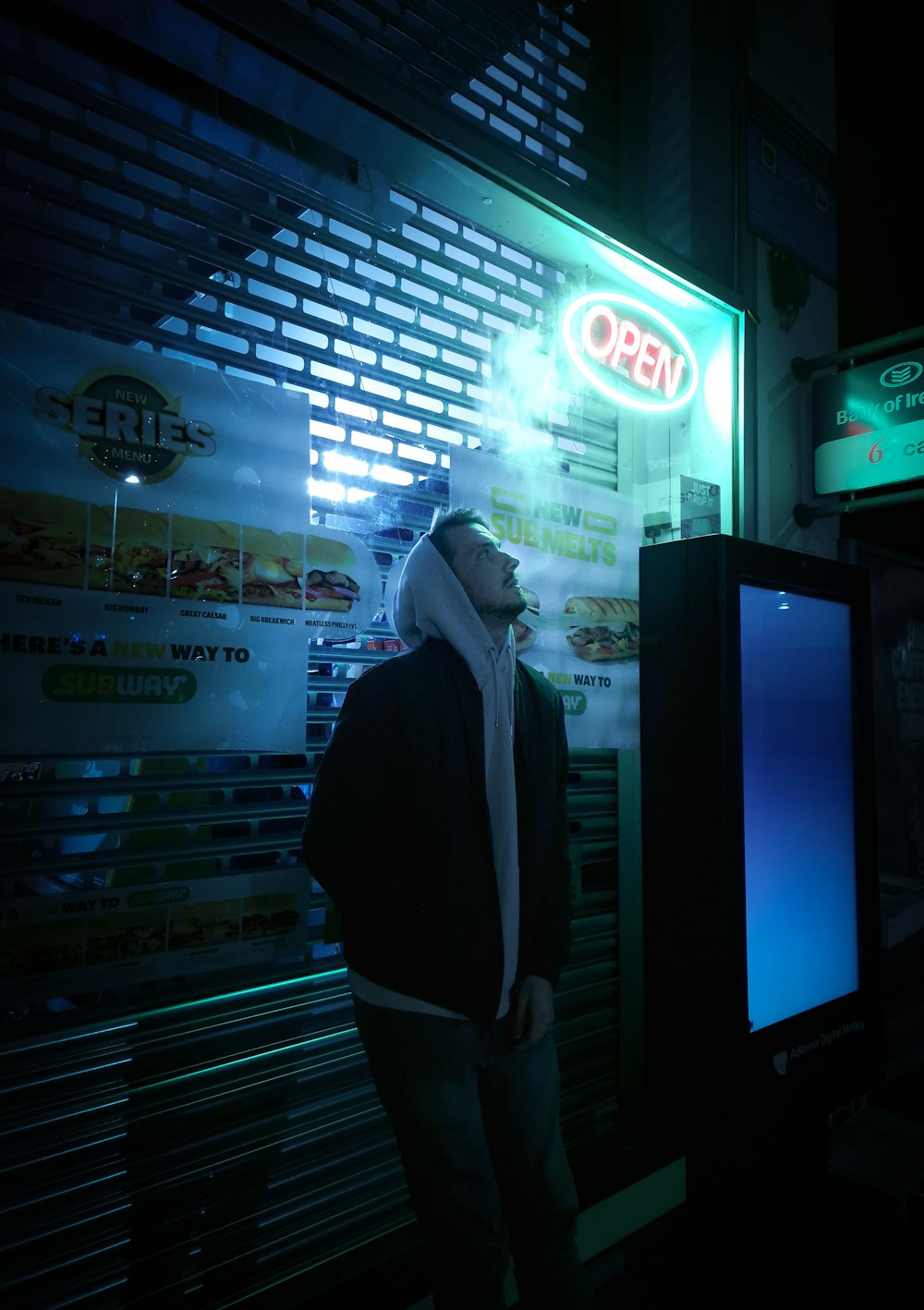 a man standing in front of a vending machine