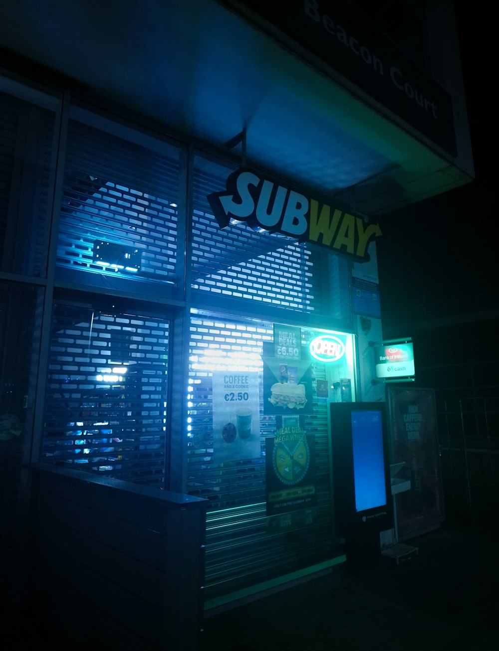 a subway sign is lit up in the dark