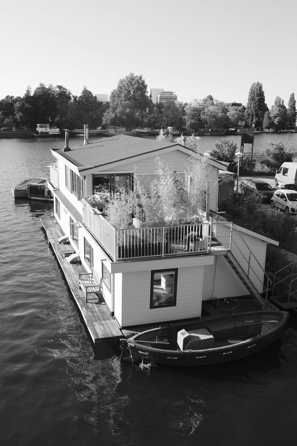 a house boat is docked at a dock
