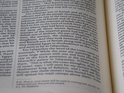 A close-up of a page from a book, displaying printed text in English. The text appears to be from a religious or historical document due to the numbered sections and the mention of biblical figures like Jeremiah. The page layout includes a two-column format with justified text and smaller subscript references at the bottom.