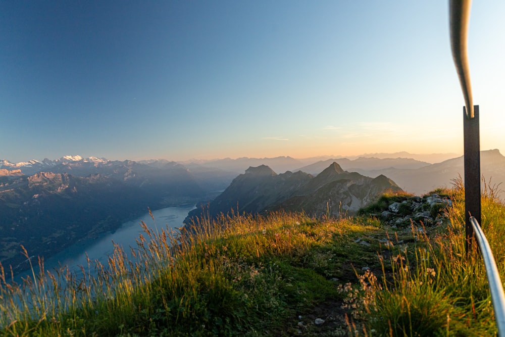 a view of a mountain with a lake in the distance