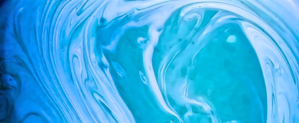a close up of a blue and white swirl