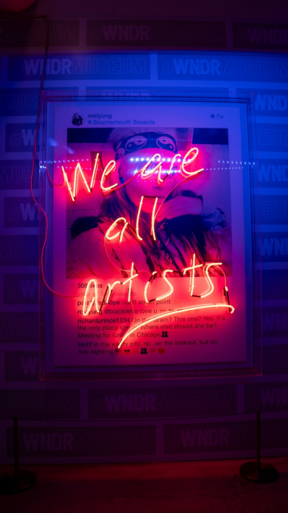 a neon sign that reads we are all artists