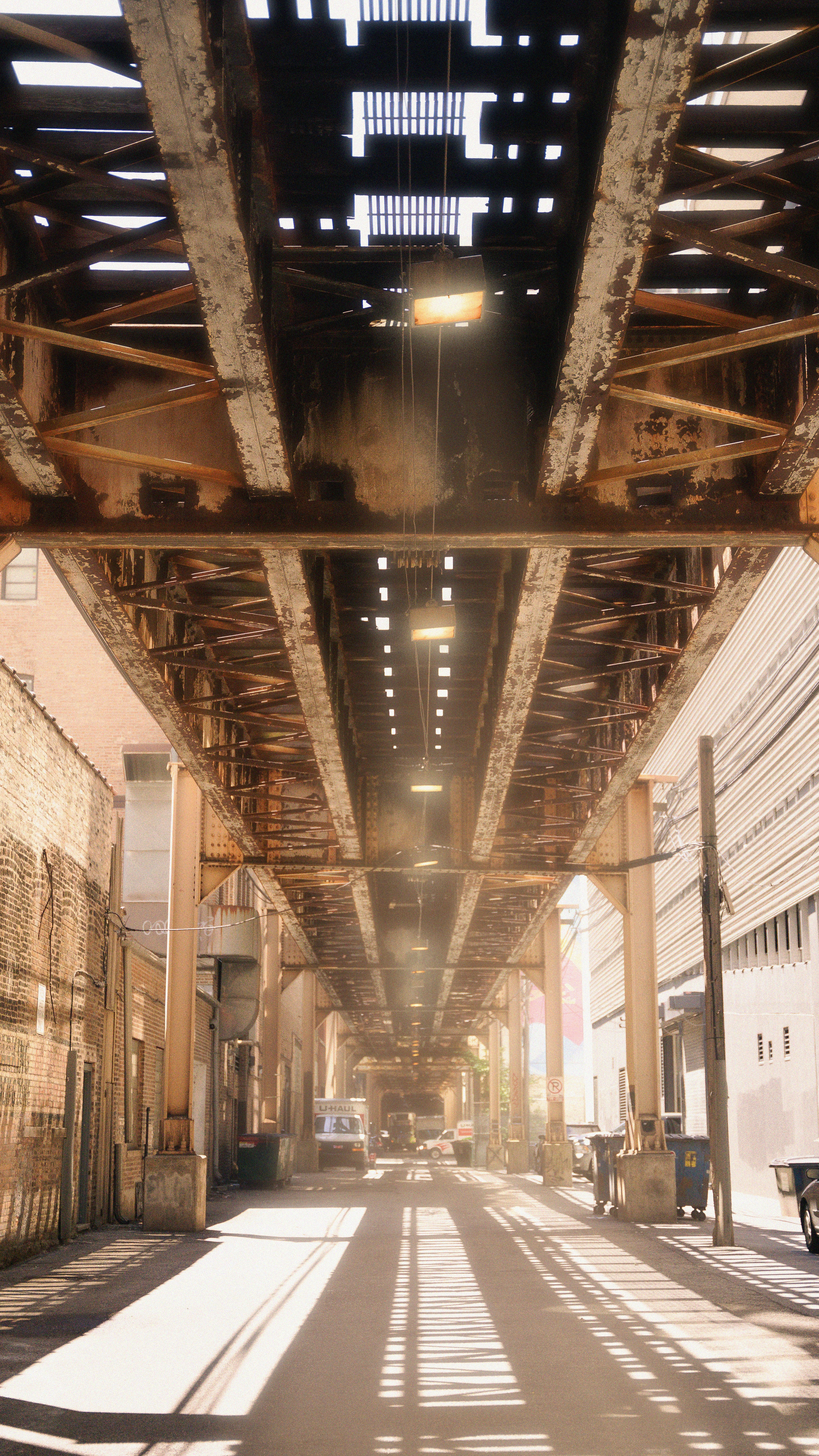a view of a street under a bridge