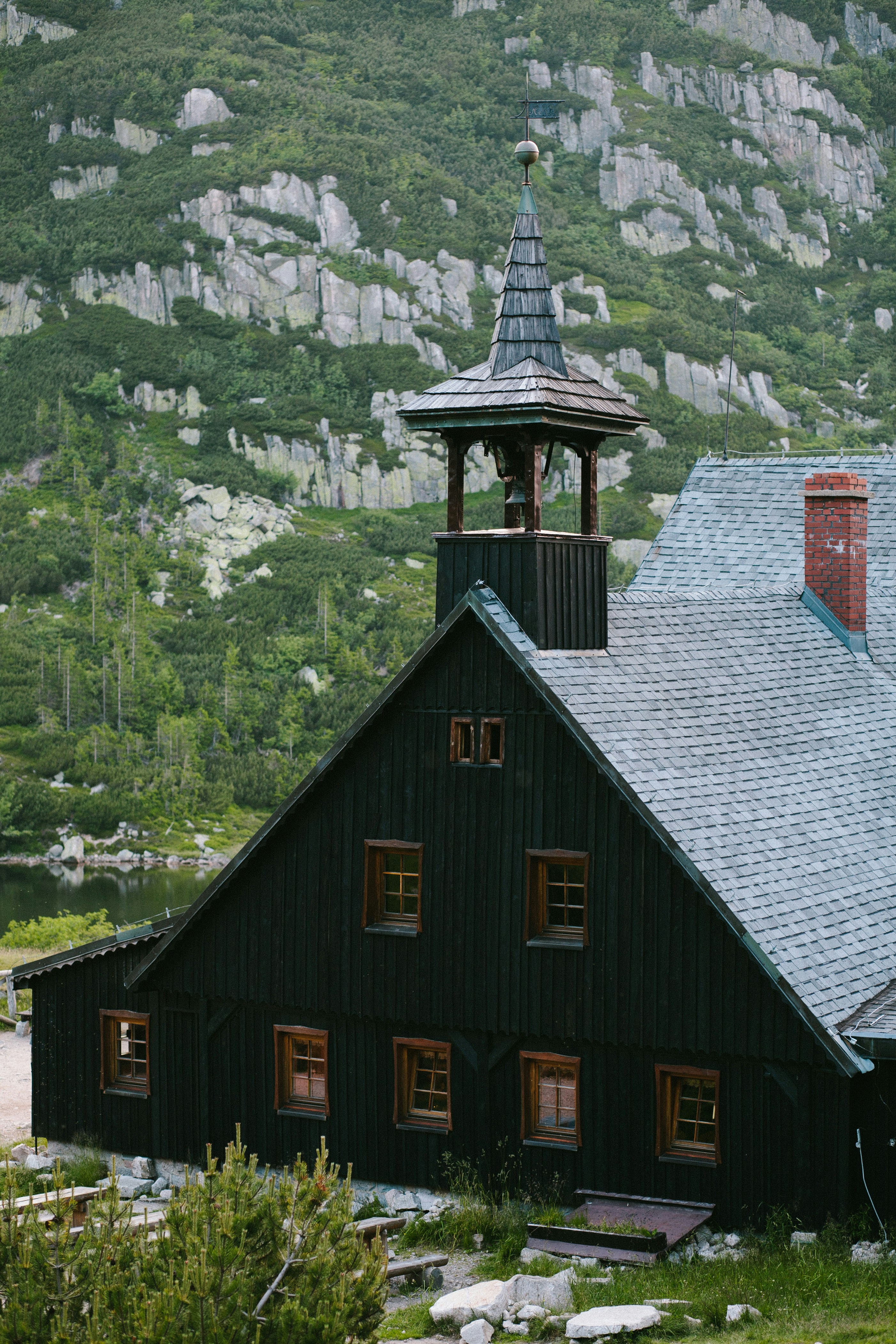 a black building with a clock tower on top of it