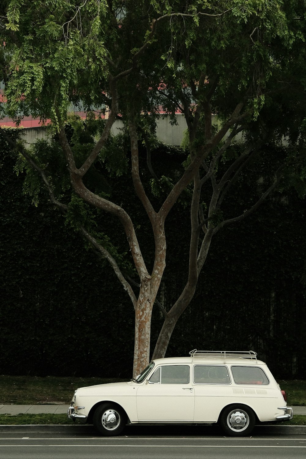 a white car parked on the side of the road