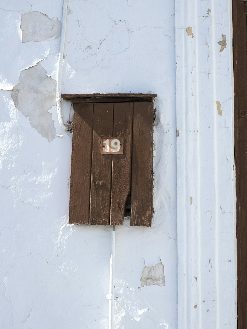 a wooden window with a number on it