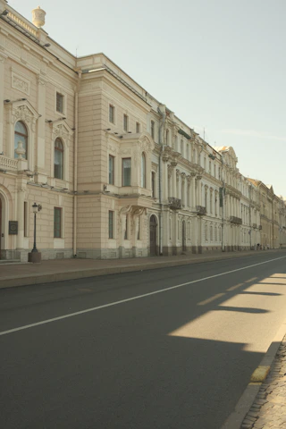 Historic brick buildings lining a quiet street in a Southern Maryland town, bathed in morning light.