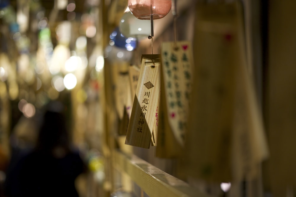 a row of wooden signs hanging on a wall