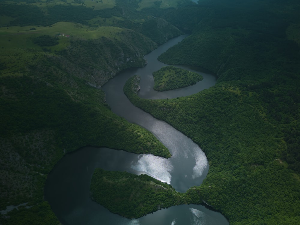 a river running through a lush green valley