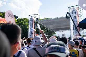Campaign volunteers organizing materials outdoors under sunny skies.