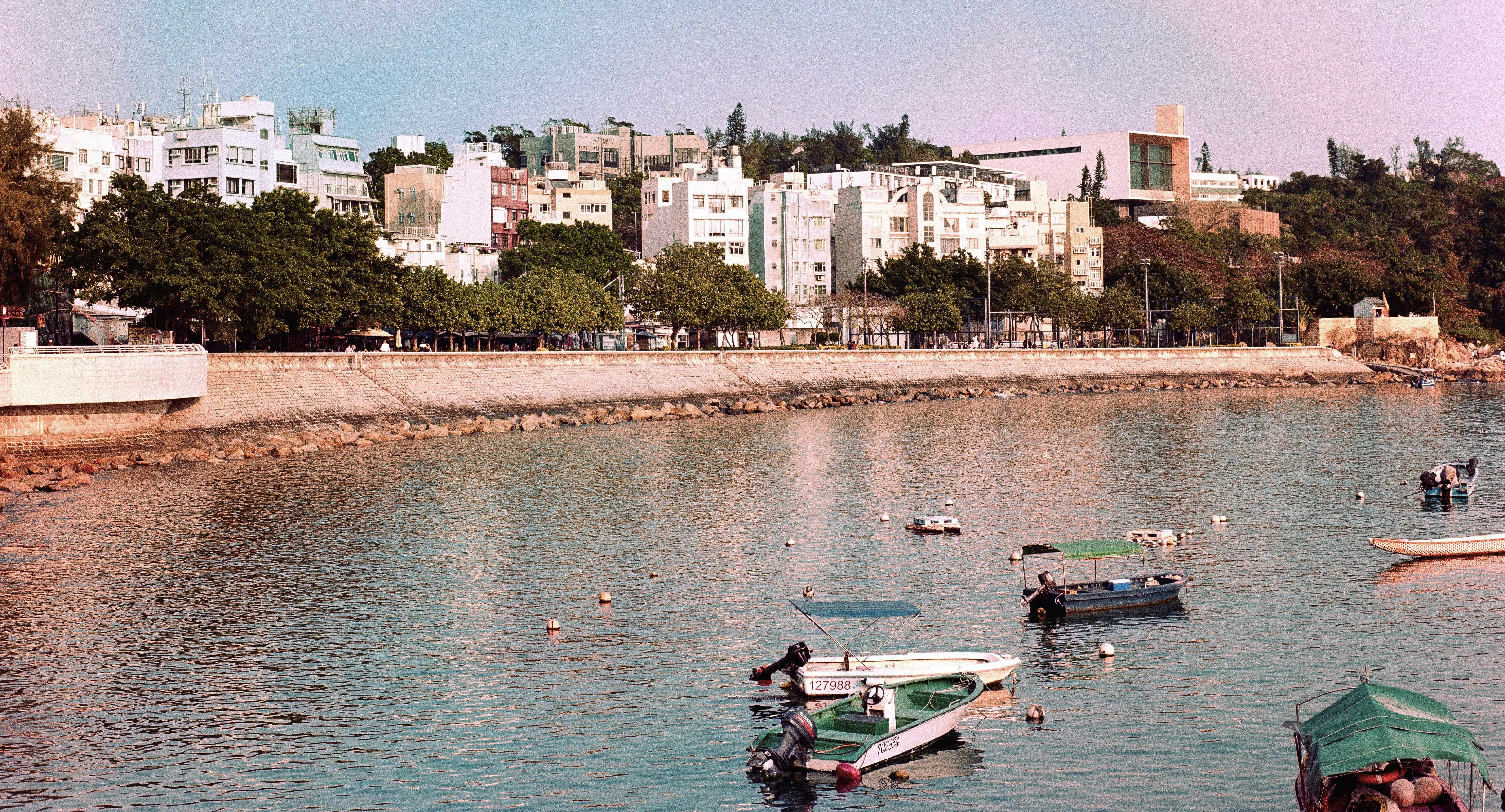 a group of boats floating on top of a lake