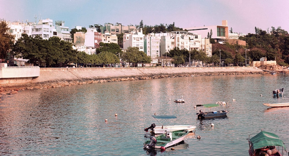 a group of boats floating on top of a lake