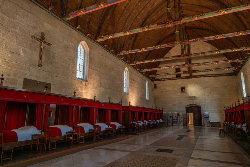 a large room with a bunch of red chairs in it