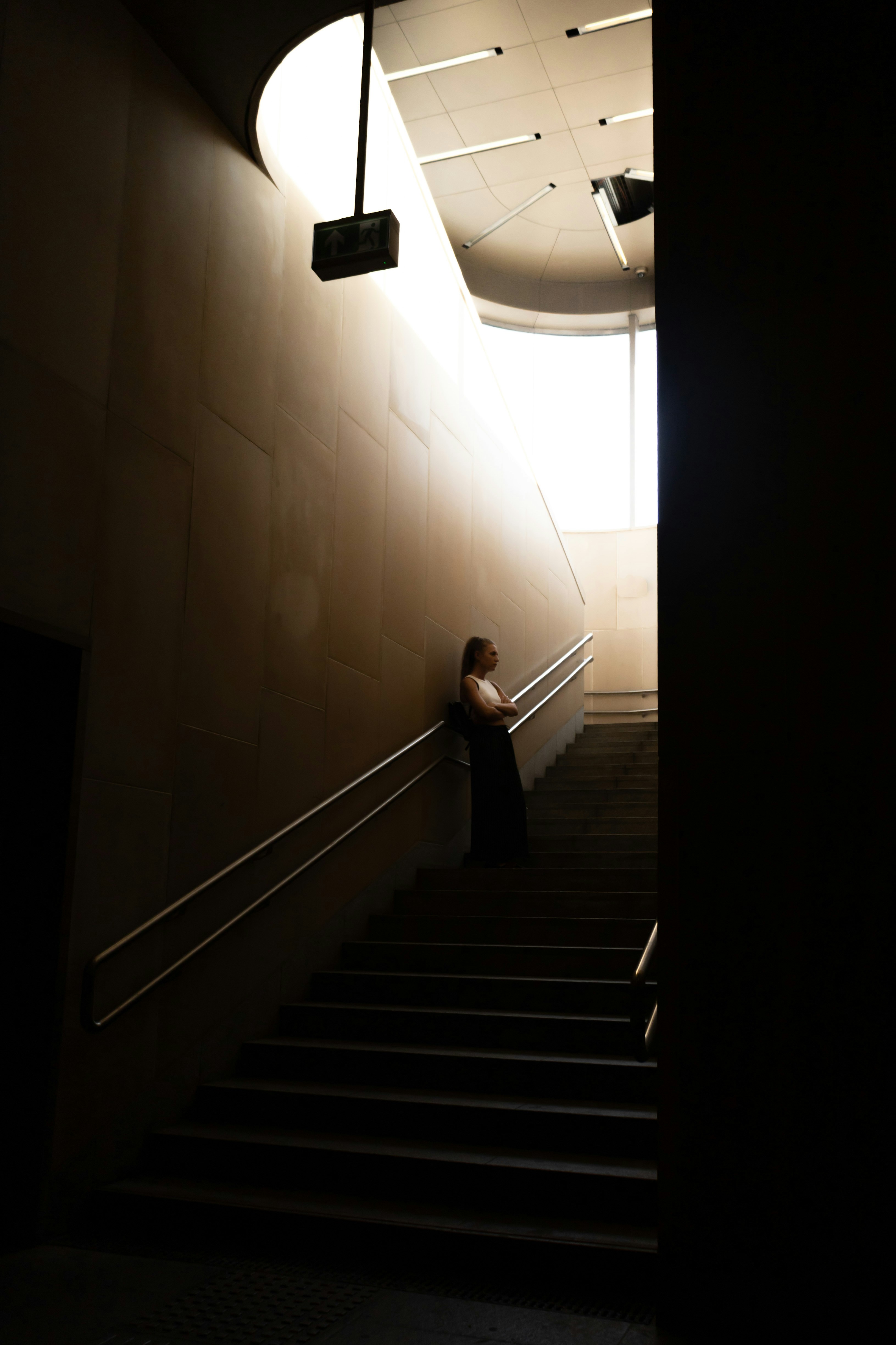 a person sitting on a set of stairs