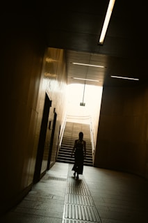 Smart lighting adjusting automatically as a person moves through a controlled access area.