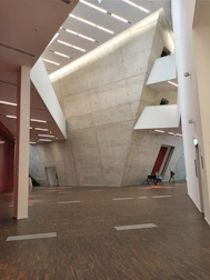 Polished concrete floor being finished inside a modern commercial space.
