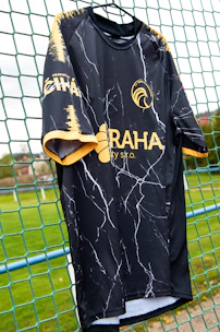 An athlete wearing a custom vintage-style jersey, mid-action on the field.