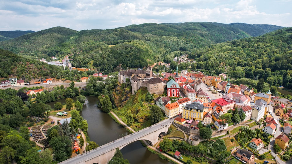 an aerial view of a town surrounded by mountains