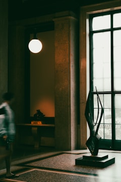 An elegant indoor sculpture surrounded by soft lighting.