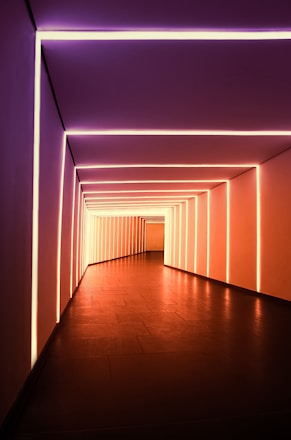 a long hallway with a lot of lights in it