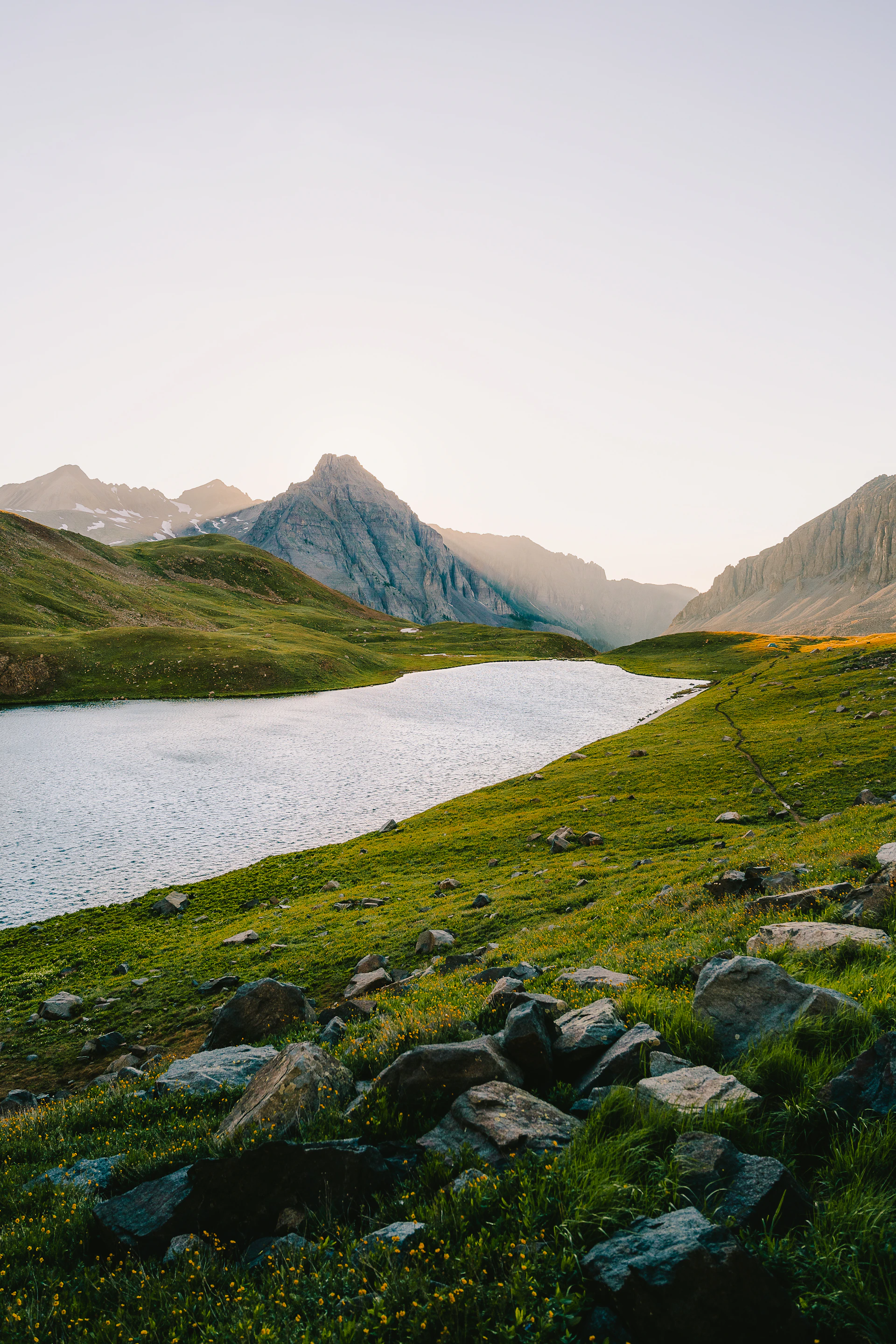 woman wearing yellow long-sleeved dress under white clouds and blue sky during daytime