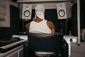 Behind-the-scenes glimpse of an independent Marathi rap artist crafting lyrics in a cozy home studio