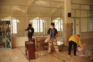 Housekeeping team preparing rooms with care and attention.