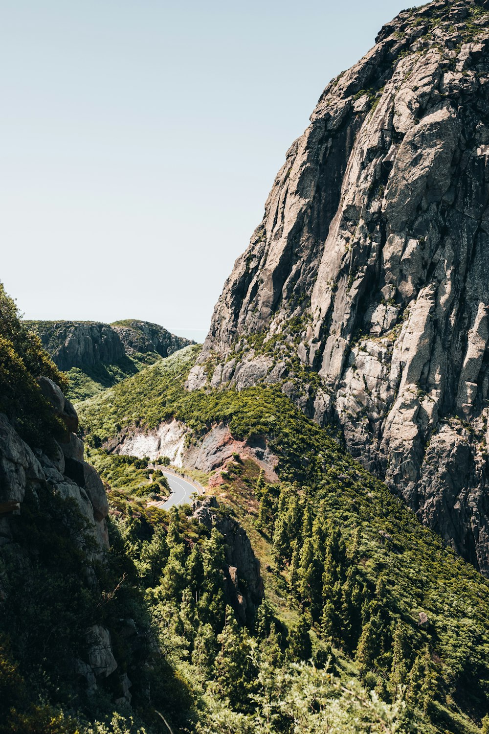 a view of a mountain with a river running through it