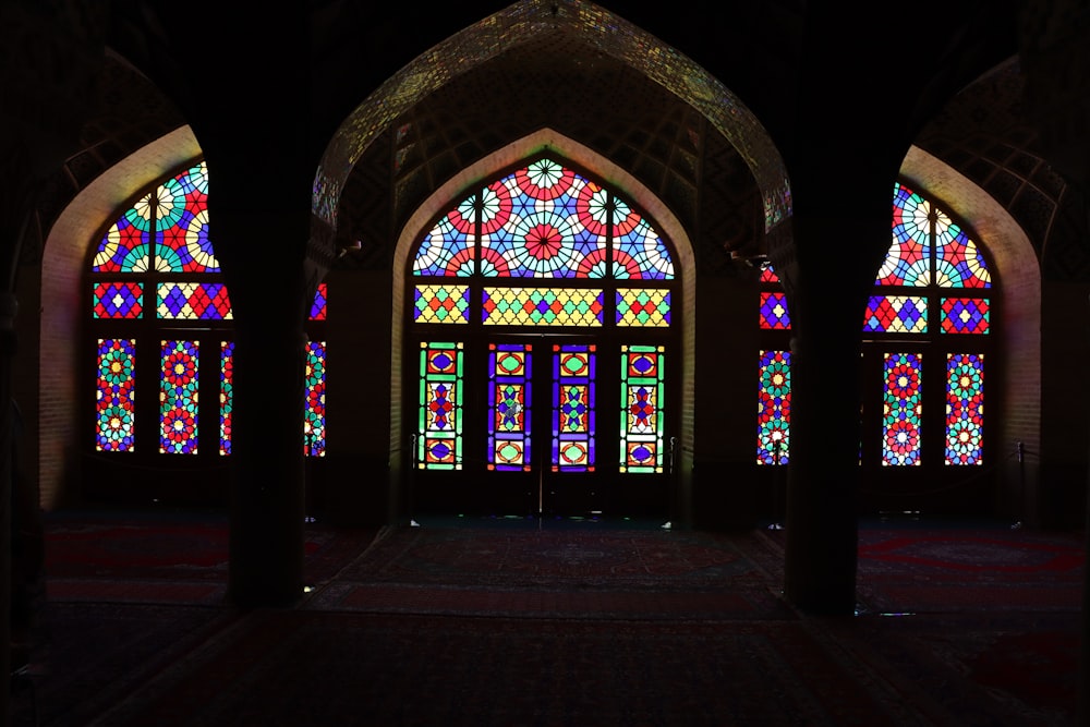 a large stained glass window inside of a building