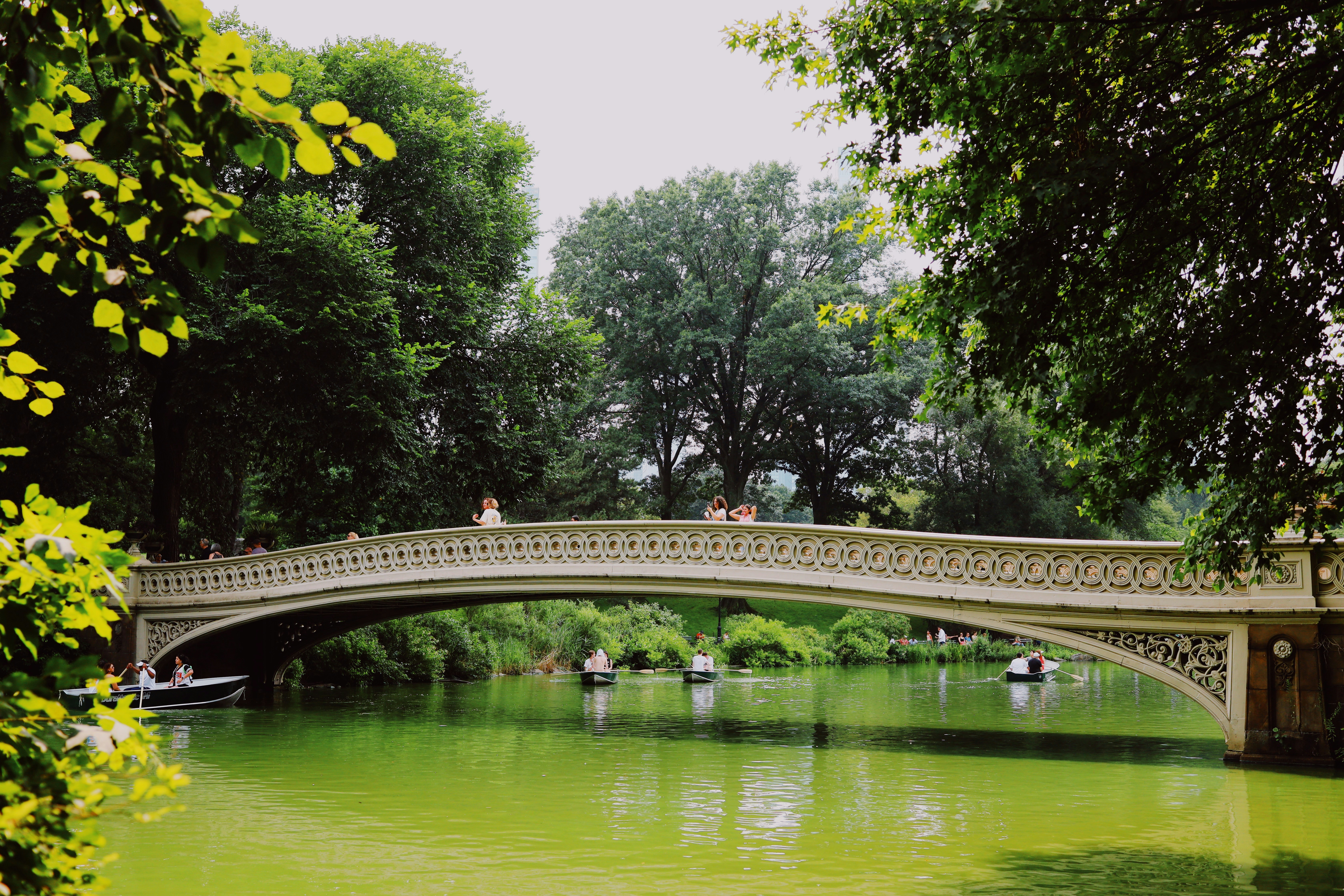 a bridge over a river with boats on it