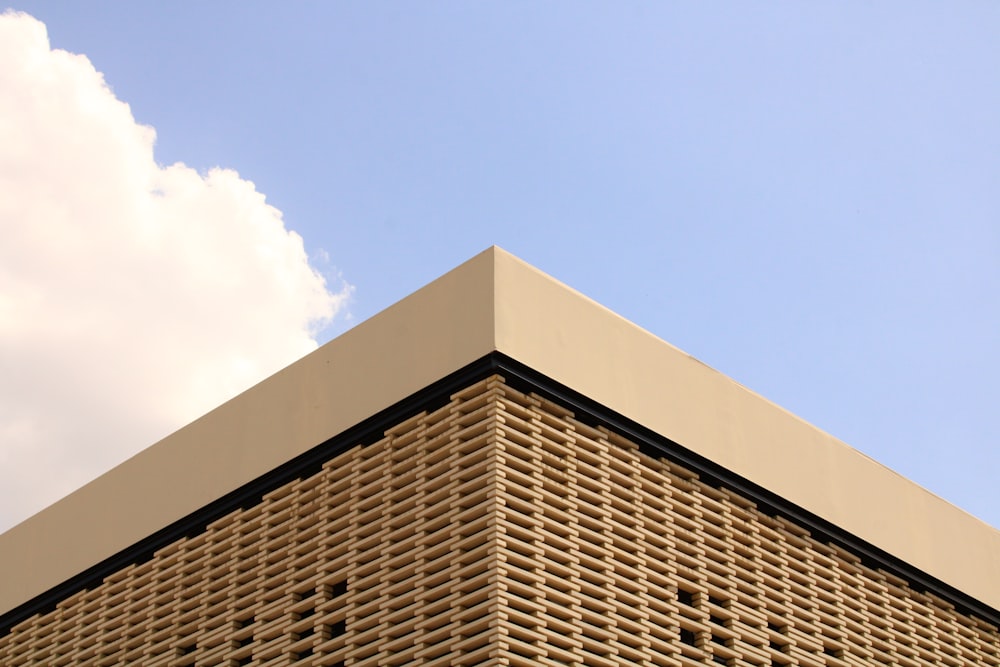 a tall building with a sky in the background