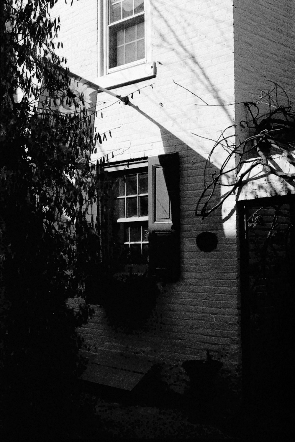 a black and white photo of a house