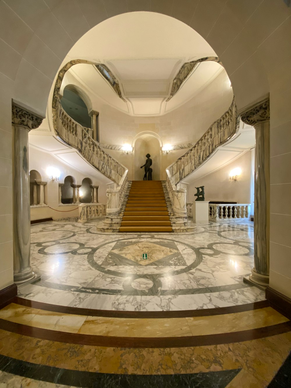 a man standing on a staircase in a building