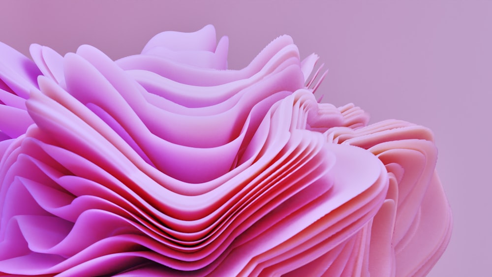 a close up of a pink paper sculpture