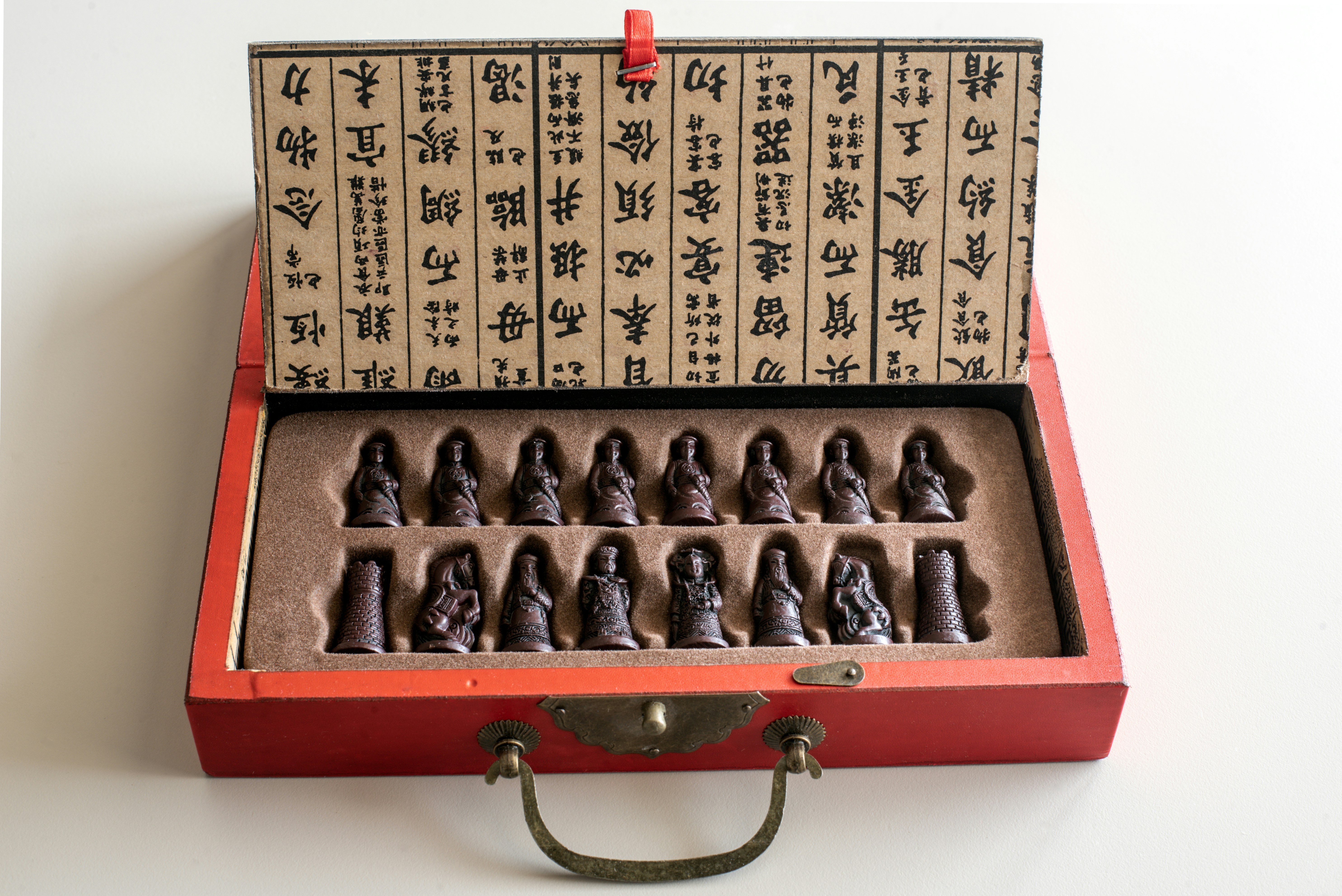 a red box with a bunch of small figurines in it