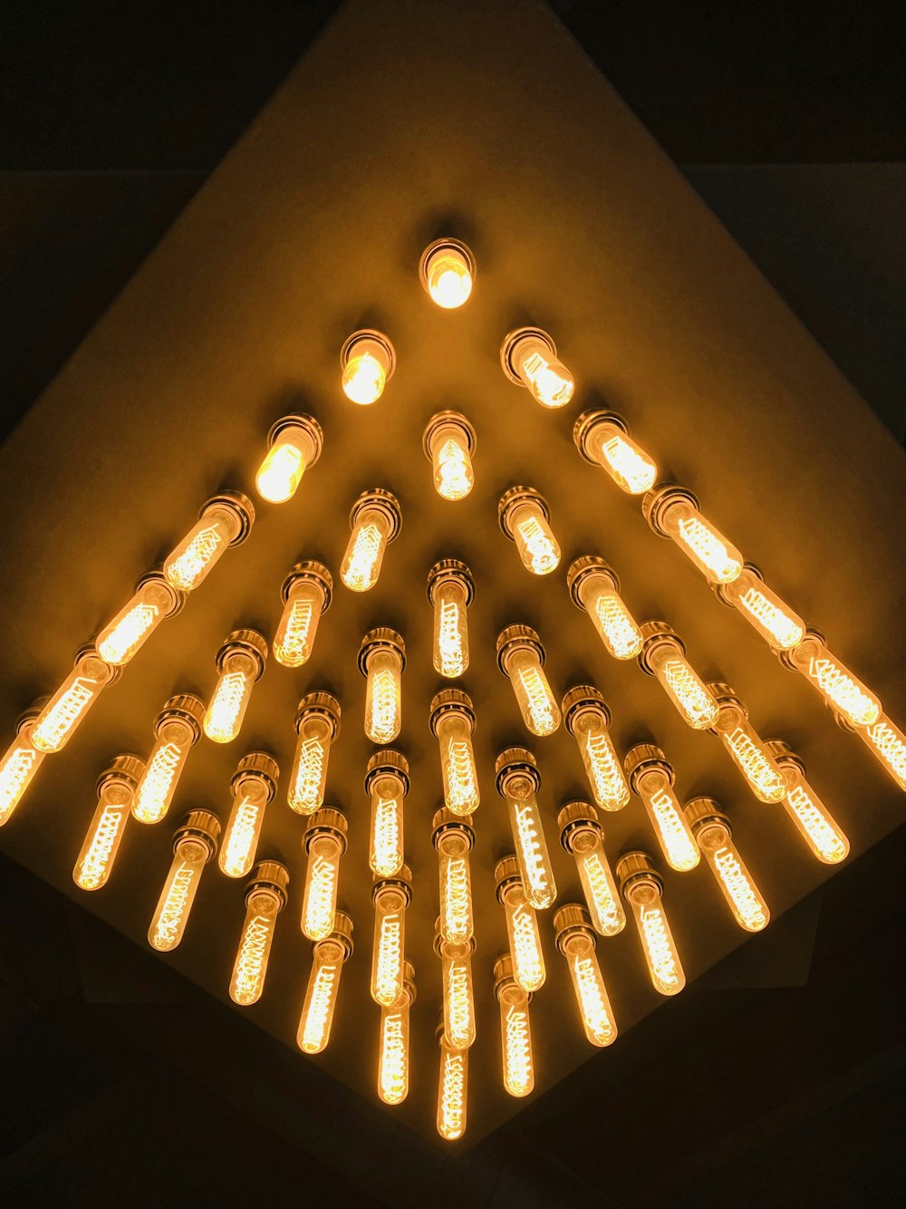 a bunch of lights that are on a ceiling