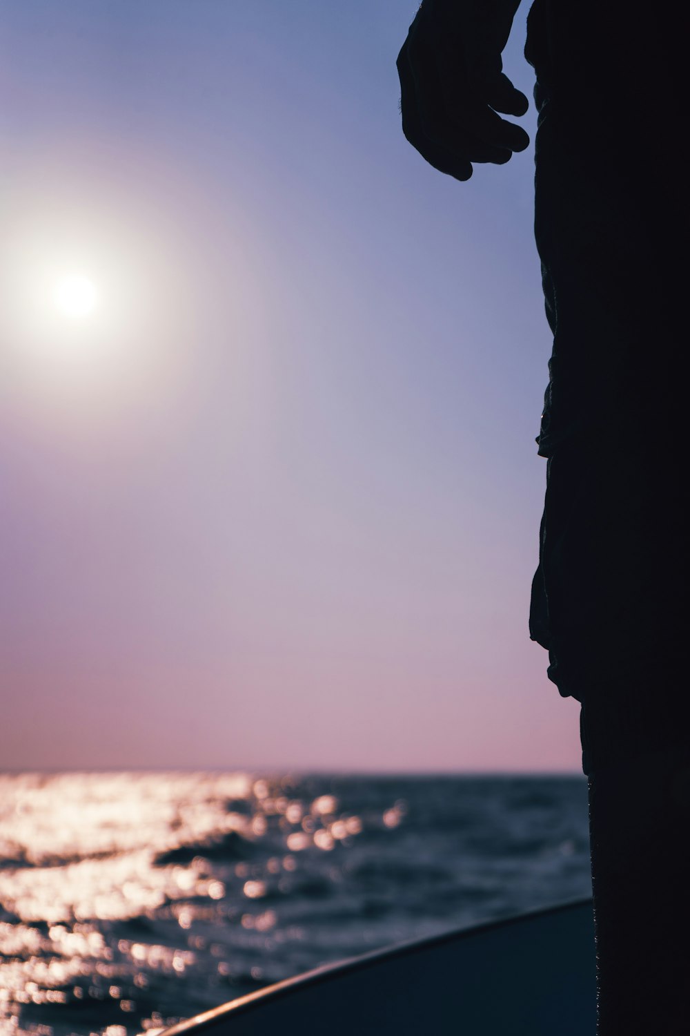 a person standing on a boat in the water